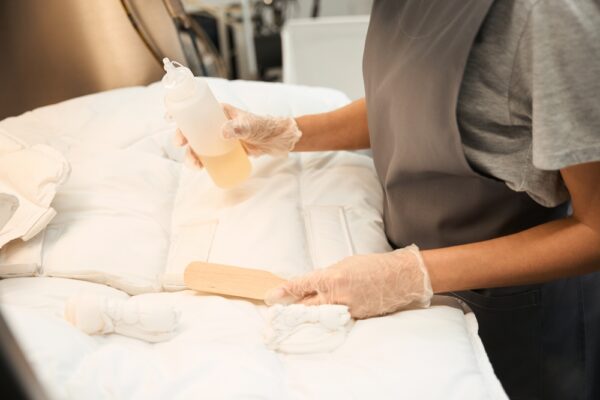 Dry-cleaning,Operator,Identifying,Stains,And,Applying,Removal,Agent